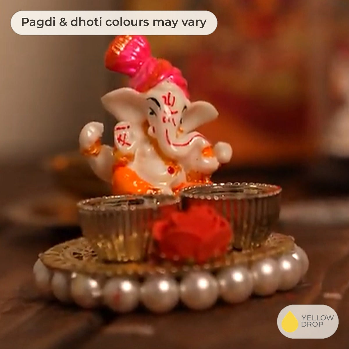 Ganesha rice and kumkum holder, side view