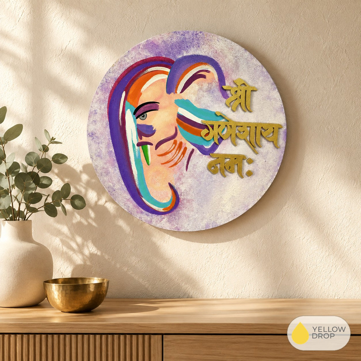 Ganesha wall hanging above a wooden console