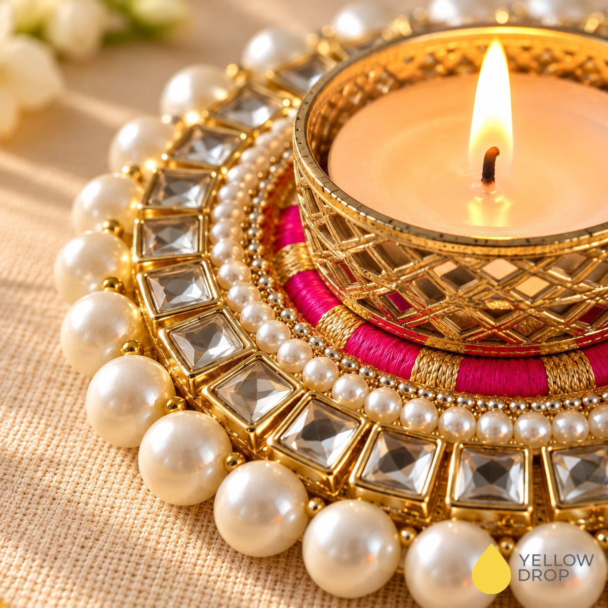 Close-up of Kundan Pearl tealight holder showing kundan stones, pearls and pink thread work