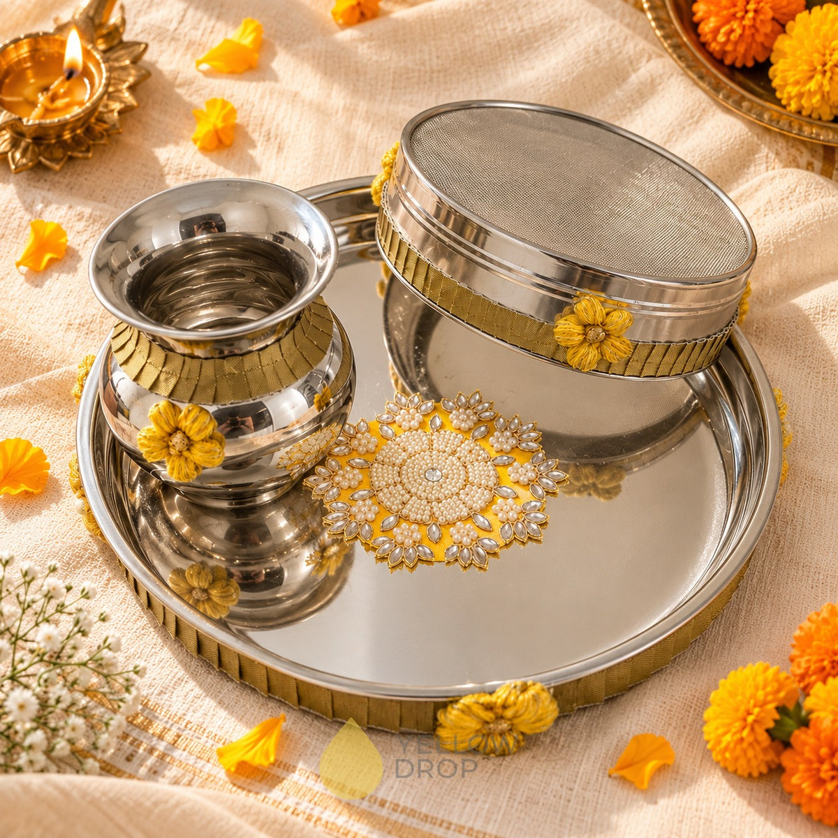 Karwa Chauth thali set of 3 with thali, gadvi and channi on cream linen with marigolds