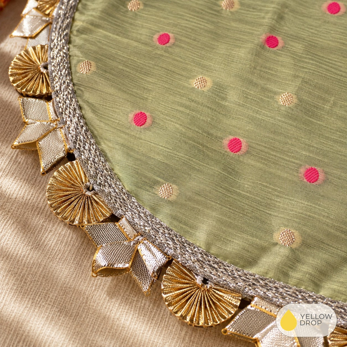 Close-up of gota border and pink dots