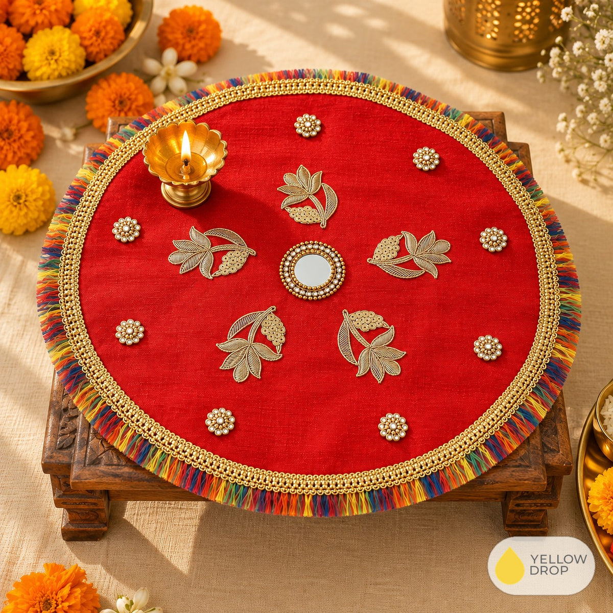 Red leaf pooja cloth on a chowki with diya