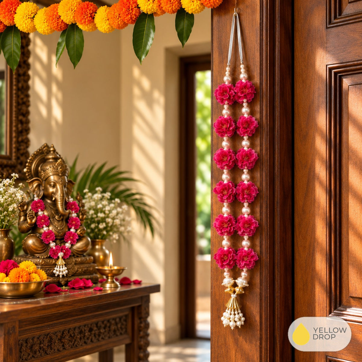 Pink flower garland draped on a Ganesha idol