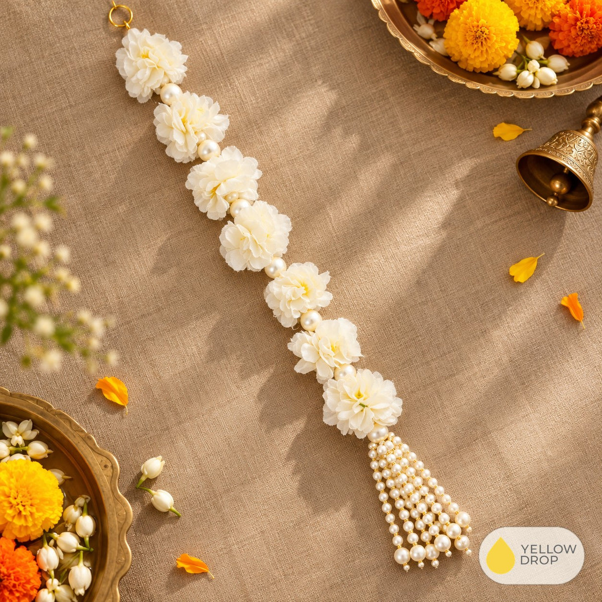 White flower tassel hanging flat-lay