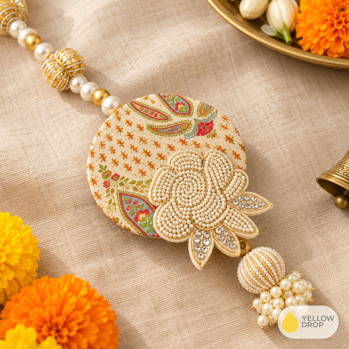 Close-up of pearl rose on cream paisley hanging