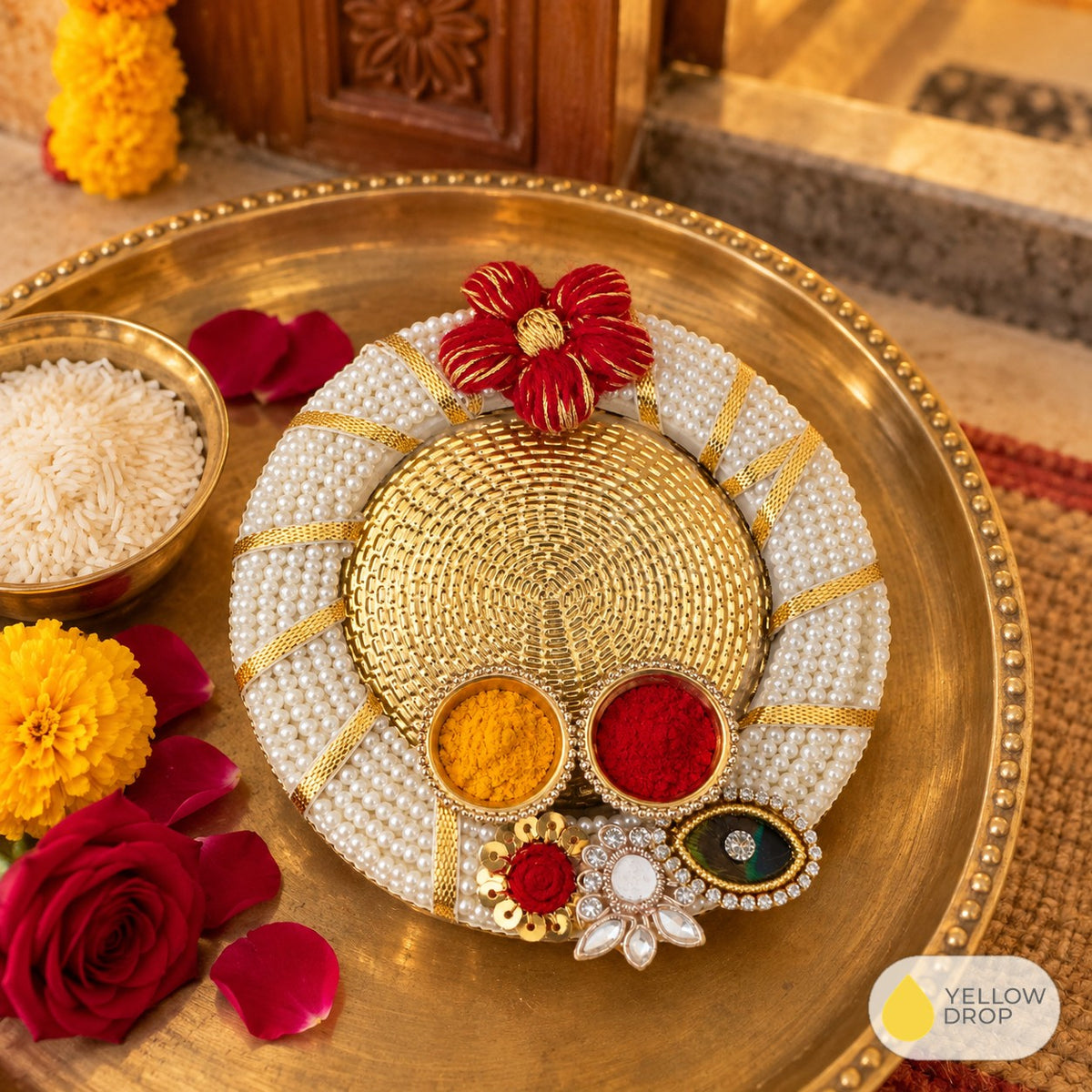 Haldi kumkum holder on a brass puja thali