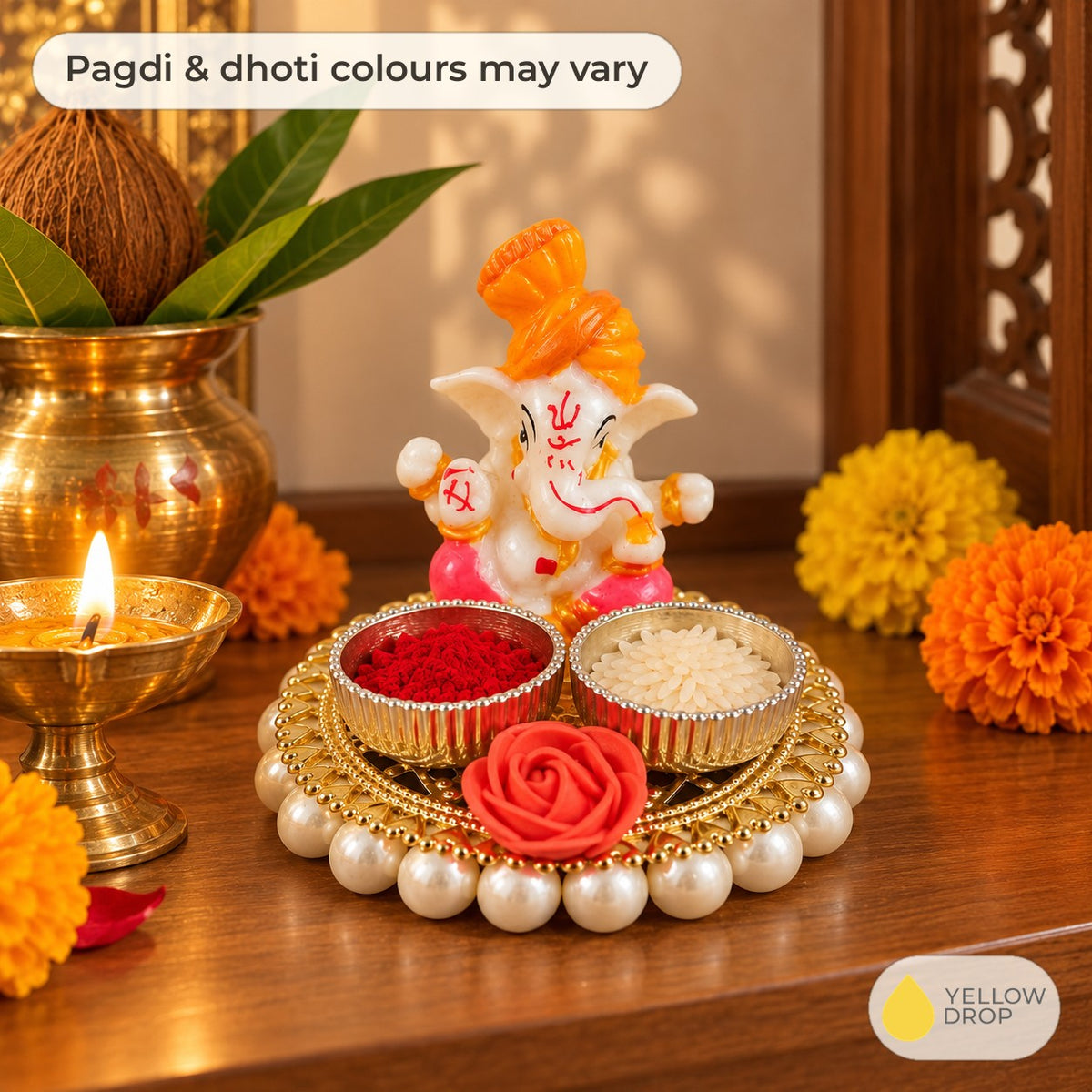 Ganesha kumkum holder on a home mandir shelf