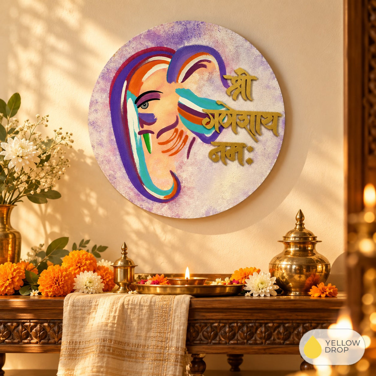 Ganesha wall hanging above a puja shelf with diya