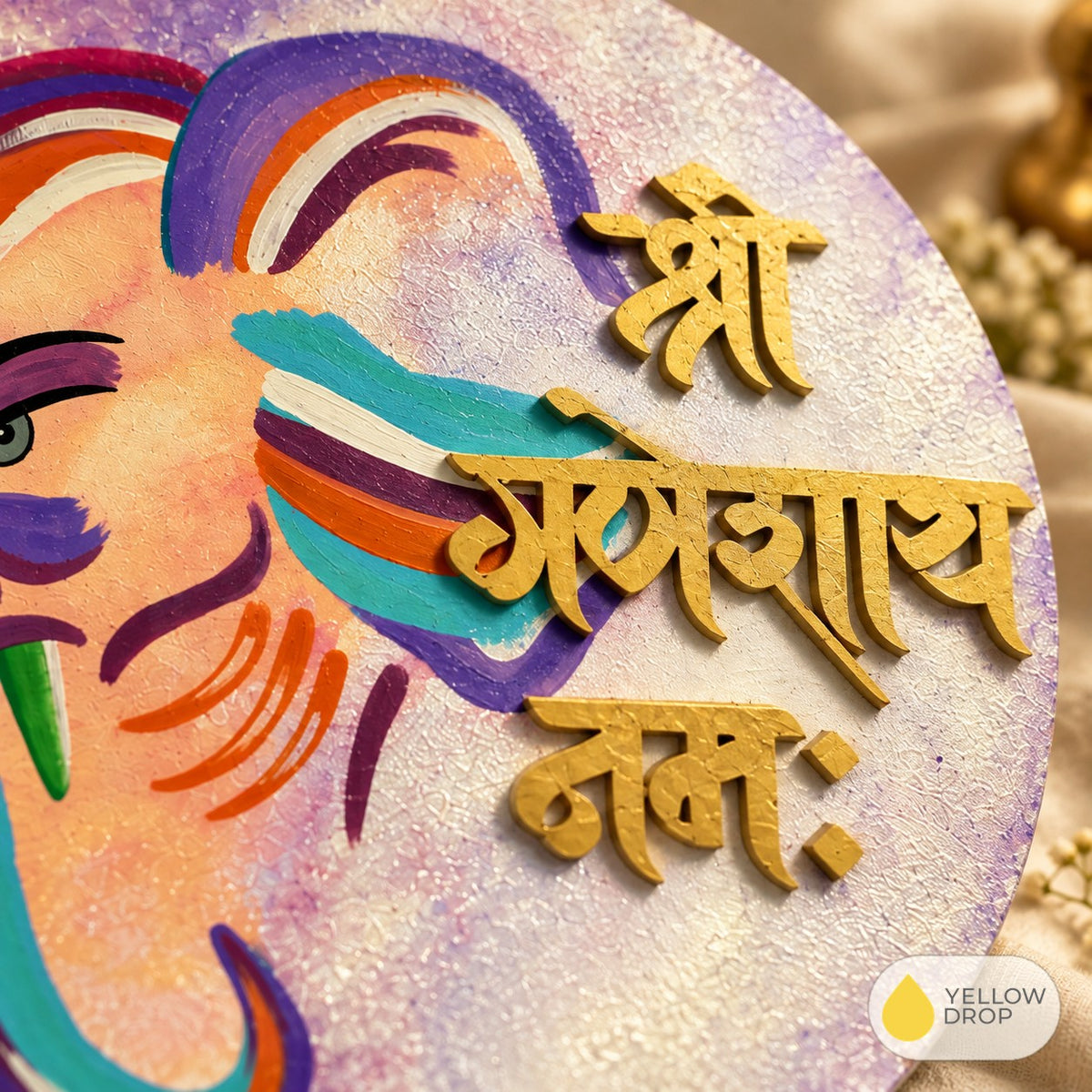 Close-up of raised gold Devanagari lettering