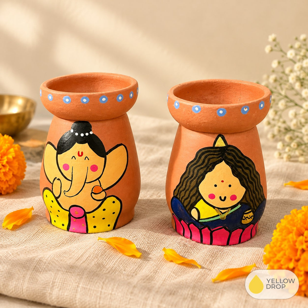 Hand-painted Ganesha and Lakshmi terracotta diya pots