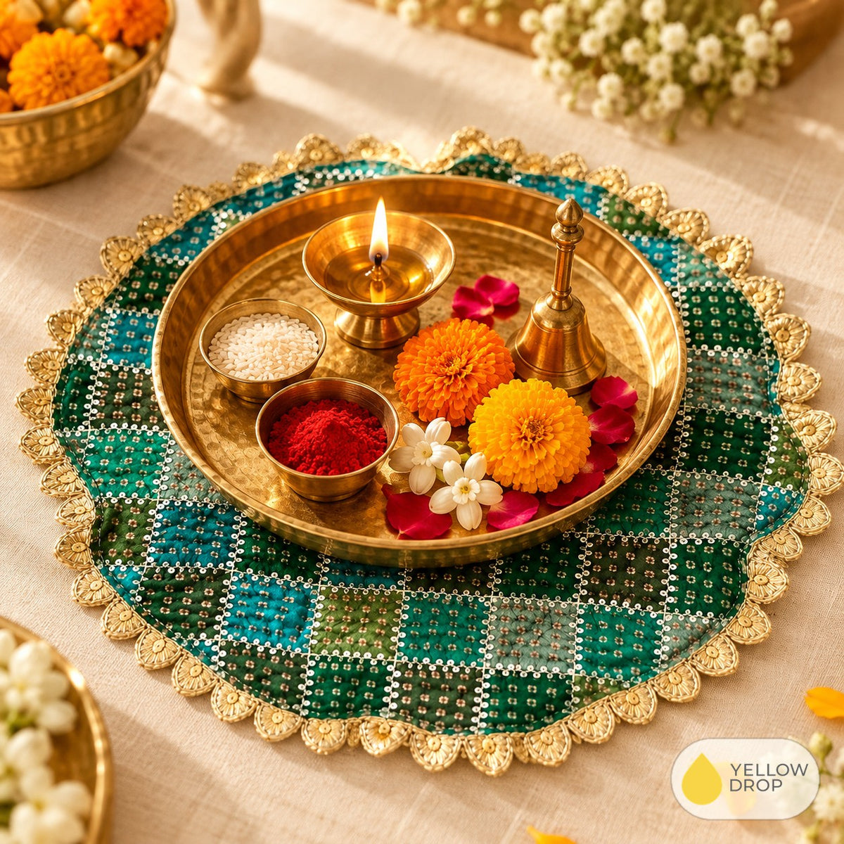 Green bandhani pooja cloth under a brass puja thali