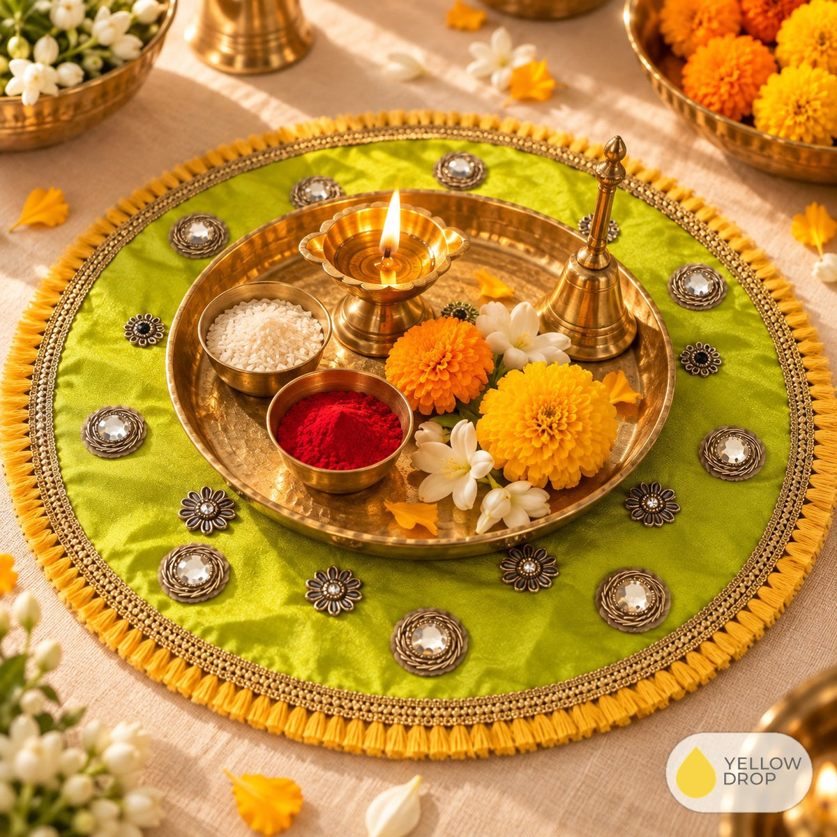 Lime mirror pooja cloth under a brass puja thali