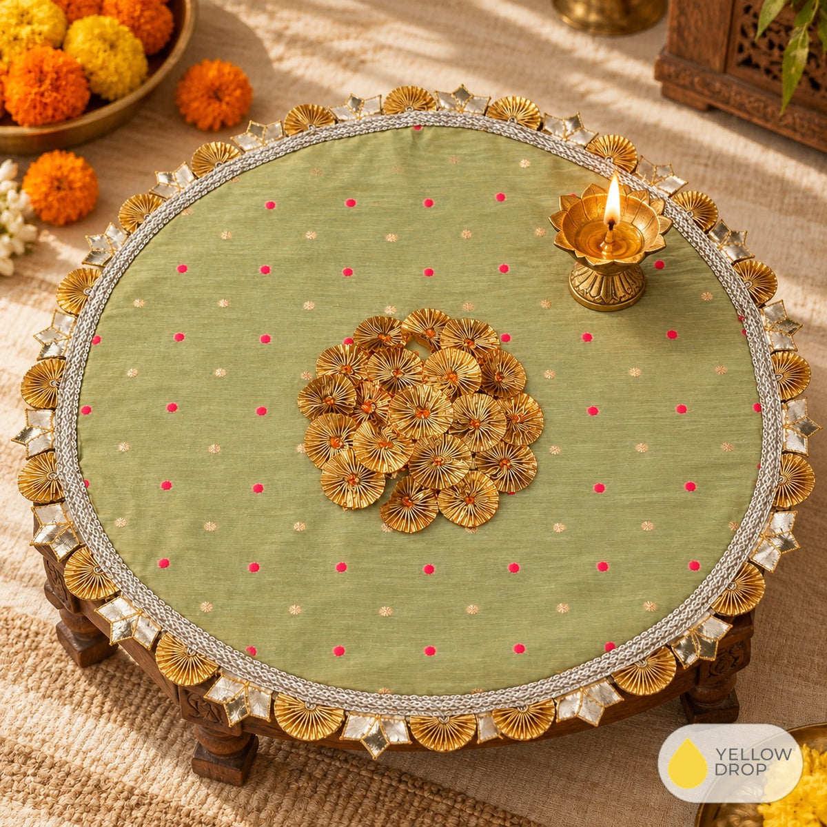 Sage gota pooja cloth on a chowki with diya